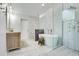 Spacious bathroom featuring tub, glass enclosed shower and tile flooring at 17927 E Apshawa Rd, Minneola, FL 34715