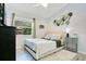 Cozy bedroom with a large window, stylish furniture and relaxing decor at 17927 E Apshawa Rd, Minneola, FL 34715