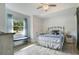 Bright bedroom with ample natural light, light-colored walls and wood-look floors at 17927 E Apshawa Rd, Minneola, FL 34715