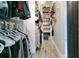 Walk-in closet with shelving, hanging storage, and modern lighting at 17927 E Apshawa Rd, Minneola, FL 34715
