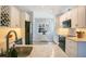 Well-lit kitchen features white cabinets, granite countertops, and stainless appliances at 17927 E Apshawa Rd, Minneola, FL 34715