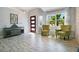 Bright, modern living room features stylish flooring, ample natural light, and neutral paint at 17927 E Apshawa Rd, Minneola, FL 34715