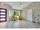 Bright, modern living room features stylish flooring, ample natural light, and neutral paint at 17927 E Apshawa Rd, Minneola, FL 34715