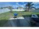 View of backyard with a grill and fence at 1909 Lakeview Pl, Kissimmee, FL 34759