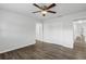 Simple bedroom with ceiling fan, and wood-look flooring at 203 E Lakeview Ave, Eustis, FL 32726