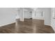 Bright and airy living area featuring modern wood-look floors and neutral walls at 203 E Lakeview Ave, Eustis, FL 32726