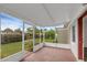 Relaxing screened-in patio offering outdoor living space with views of the backyard at 203 E Lakeview Ave, Eustis, FL 32726