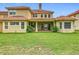 Rear view of the property showcasing the patio, yard, and architecture at 2209 Callaway Ct, Davenport, FL 33837