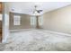 Spacious carpeted bedroom with multiple windows and ample natural light for relaxation and comfort at 2209 Callaway Ct, Davenport, FL 33837
