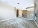 Spacious bonus room offers versatility with archways and an open railing overlooking downstairs at 2209 Callaway Ct, Davenport, FL 33837