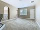 The bonus room includes a window for natural light, ample space, and an open railing at 2209 Callaway Ct, Davenport, FL 33837