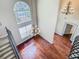 Elegant foyer showcasing hardwood floors, soaring ceilings, chandeliers, and a grand staircase at 2209 Callaway Ct, Davenport, FL 33837