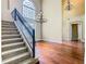 An interior view of a living room featuring hardwood floors, a staircase, and high ceilings at 2209 Callaway Ct, Davenport, FL 33837