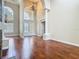 An interior view of a living room featuring a fireplace, hardwood floors, and high ceilings at 2209 Callaway Ct, Davenport, FL 33837