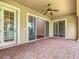 Spacious patio with brick flooring and sliding glass doors leading to the interior at 2209 Callaway Ct, Davenport, FL 33837