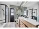 Bathroom showcasing double vanity, and glass-enclosed shower, and tile floors at 2235 Meadowmouse St, Orlando, FL 32837