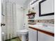 Bathroom with shower and tub combination, a shelf for storage, and a single sink vanity at 2235 Meadowmouse St, Orlando, FL 32837