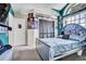Bedroom with vaulted ceilings has fan art, black-out blinds, and an abundance of natural light at 2235 Meadowmouse St, Orlando, FL 32837