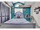 Unique bedroom has vaulted ceilings, fun anime decor, a window seat, and a gaming station at 2235 Meadowmouse St, Orlando, FL 32837