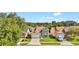 Charming two-story home with a well-maintained lawn and a two-car garage at 2235 Meadowmouse St, Orlando, FL 32837