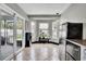 Bright eat-in kitchen features stainless steel appliances, tile floors and natural light at 2235 Meadowmouse St, Orlando, FL 32837