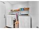 Well-equipped laundry room with modern washer and dryer and ample storage at 2235 Meadowmouse St, Orlando, FL 32837