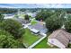 Aerial view of home in a quiet neighborhood featuring mature landscaping and well-maintained lawns at 253 Churchill Ct, Kissimmee, FL 34758