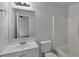 Well-lit bathroom showcasing a vanity with ample counter space, tub-shower combo and tiled floor at 253 Churchill Ct, Kissimmee, FL 34758