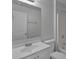 Functional bathroom features a single sink vanity, and a shower-tub combo, complete with a mirrored wall at 253 Churchill Ct, Kissimmee, FL 34758