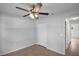 Neutral bedroom featuring a ceiling fan, closet, and tiled flooring for a clean and comfortable space at 253 Churchill Ct, Kissimmee, FL 34758