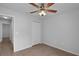 Comfortable bedroom featuring a ceiling fan, closet, and tile flooring for ease of maintenance at 253 Churchill Ct, Kissimmee, FL 34758