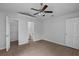Spacious bedroom featuring a closet, ensuite bathroom, and tile flooring providing ample storage at 253 Churchill Ct, Kissimmee, FL 34758