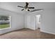 Spacious bedroom featuring an ensuite bathroom, window, and a closet, ideal for a Primary suite at 253 Churchill Ct, Kissimmee, FL 34758