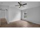 Bright bedroom with large window, a ceiling fan, and tile flooring offers a comfortable and welcoming space at 253 Churchill Ct, Kissimmee, FL 34758