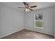 Bright bedroom featuring a window overlooking a green lawn, offering a serene and refreshing view at 253 Churchill Ct, Kissimmee, FL 34758