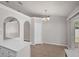 Bright dining area with sliding glass doors and stylish tile flooring at 253 Churchill Ct, Kissimmee, FL 34758