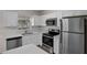 Modern kitchen boasting stainless steel appliances and ample counter space at 253 Churchill Ct, Kissimmee, FL 34758