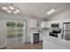 Updated kitchen featuring stainless steel appliances and backyard access at 253 Churchill Ct, Kissimmee, FL 34758