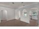 Spacious living room featuring unique architectural arches and tile flooring at 253 Churchill Ct, Kissimmee, FL 34758