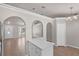 Open-concept living area boasts stylish tile flooring and seamless transitions to the kitchen and dining areas at 253 Churchill Ct, Kissimmee, FL 34758