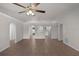 Open-concept living room with tile floors, arched doorways, and a ceiling fan at 253 Churchill Ct, Kissimmee, FL 34758