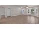 Large living room features tile floors, lots of natural light, arched doorways, and neutral walls at 253 Churchill Ct, Kissimmee, FL 34758
