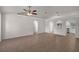 Open-concept living space with tile floors, archways, and view into the kitchen at 253 Churchill Ct, Kissimmee, FL 34758