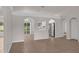 Spacious living room with tile flooring, arched doorways, and natural light at 253 Churchill Ct, Kissimmee, FL 34758