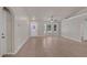 Spacious living area with ceramic tile flooring, white walls, and front door with decorative glass at 253 Churchill Ct, Kissimmee, FL 34758