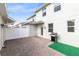 Private backyard with a brick-paved patio, perfect for outdoor gatherings at 3099 Ella Way, St Cloud, FL 34771