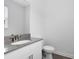 Clean and modern half bathroom with granite countertops and updated fixtures at 3099 Ella Way, St Cloud, FL 34771
