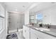 Bright bathroom with double vanity, and large glass enclosed shower at 3099 Ella Way, St Cloud, FL 34771