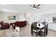 Open-concept living and dining area with modern furniture, sleek countertops, and neutral tones for a bright and airy atmosphere at 3099 Ella Way, St Cloud, FL 34771