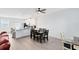 Spacious open-concept layout with a modern kitchen, dining area, and comfortable living space, perfect for gatherings at 3099 Ella Way, St Cloud, FL 34771